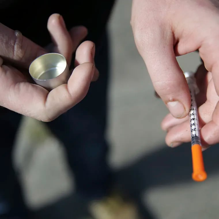 A person who uses fentanyl holds a needle near Kensington and Cambria in Philadelphia in 2018. Fentanyl wears off quickly and sends people addicted to it into withdrawal faster, making it hard for them to seek help because they're in too much pain to wait to be assessed for treatment, a recent study from Thomas Jefferson University found.