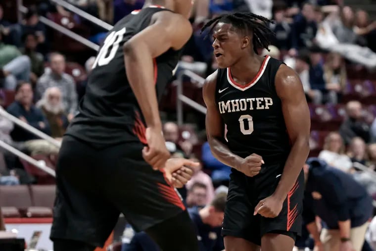 Imhotep’s Ahmad Nowell reacts when Imhotep expands its lead late in the fourth quarter against Franklin Regional in the PIAA Class 5A boys' championship at the Giant Center in Hershey on March 22.