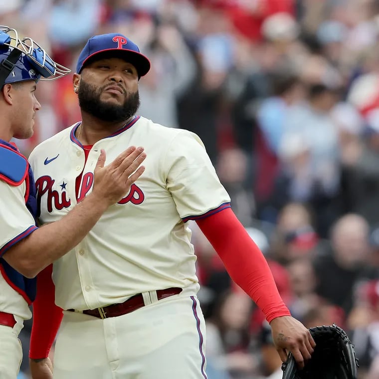 Philadelphia Phillies catcher J.T. Realmuto (left) and Philadelphia Phillies relief pitcher Jose Alvarado (right) celebrate after their first win of the season.